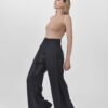 Model with black wide leg trousers