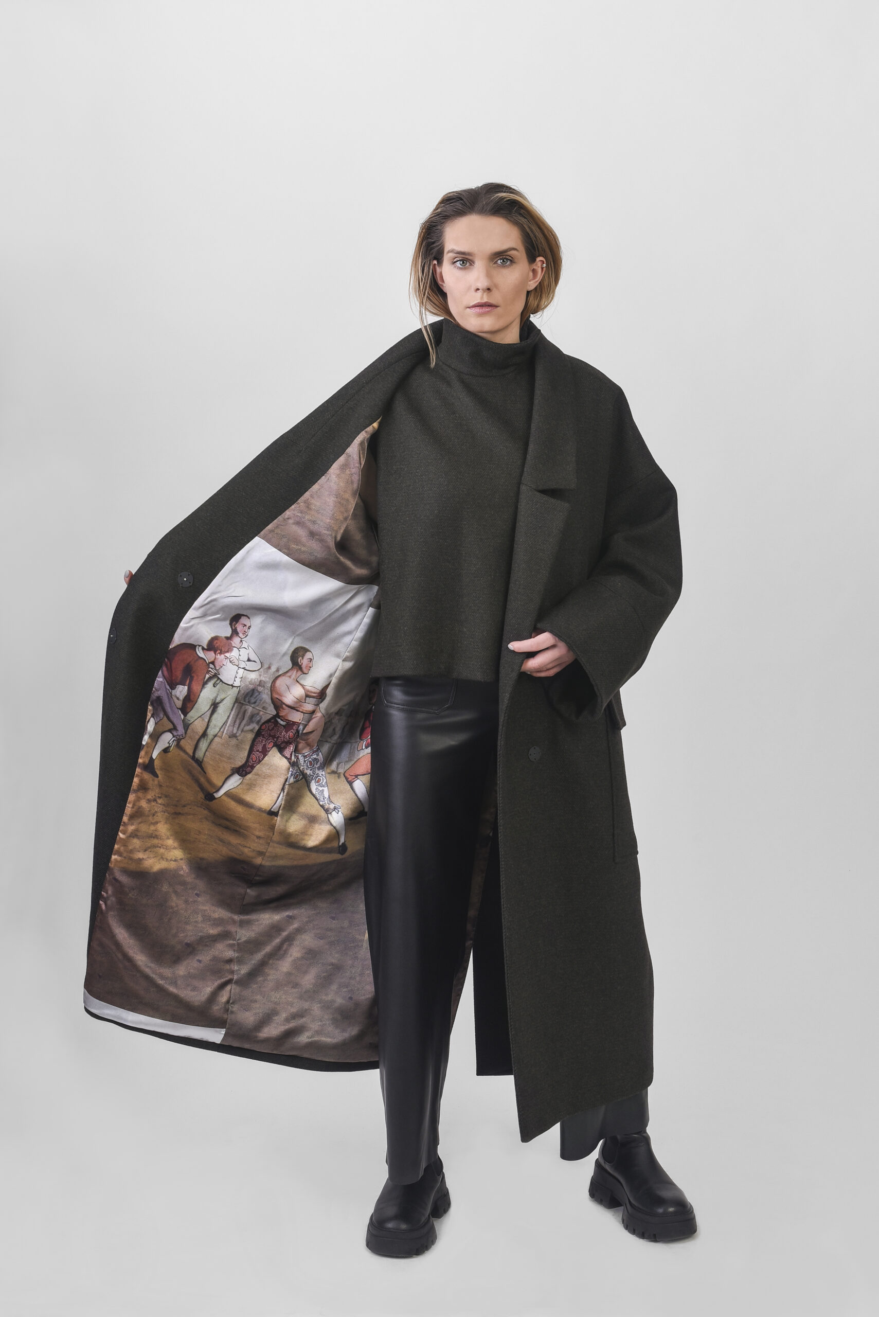 model with green oversize coat